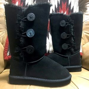 Brand new UGG tall black with buttons, size 5.